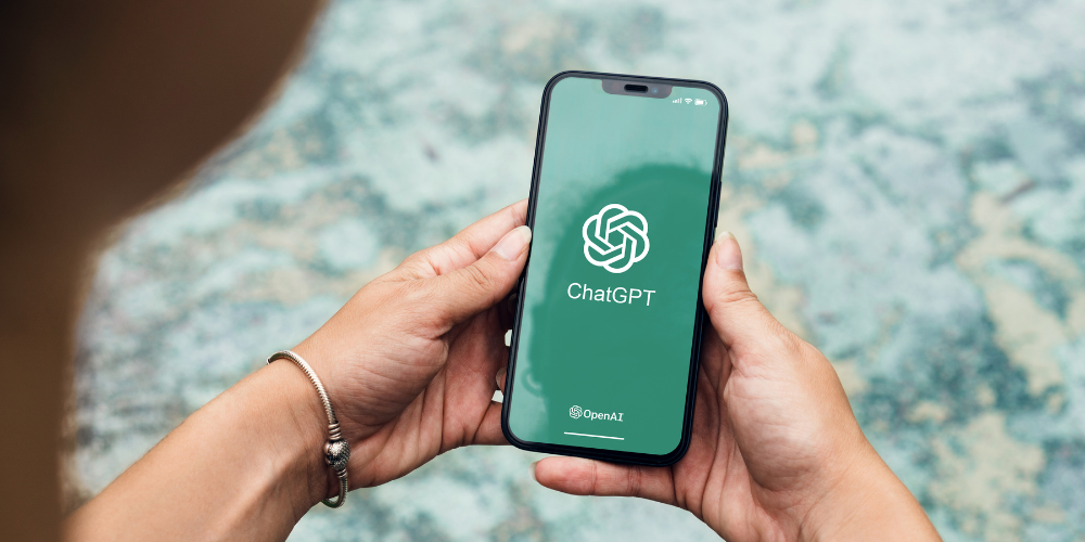 Person on mobile phone looking at ChatGPT - Dig & Dig