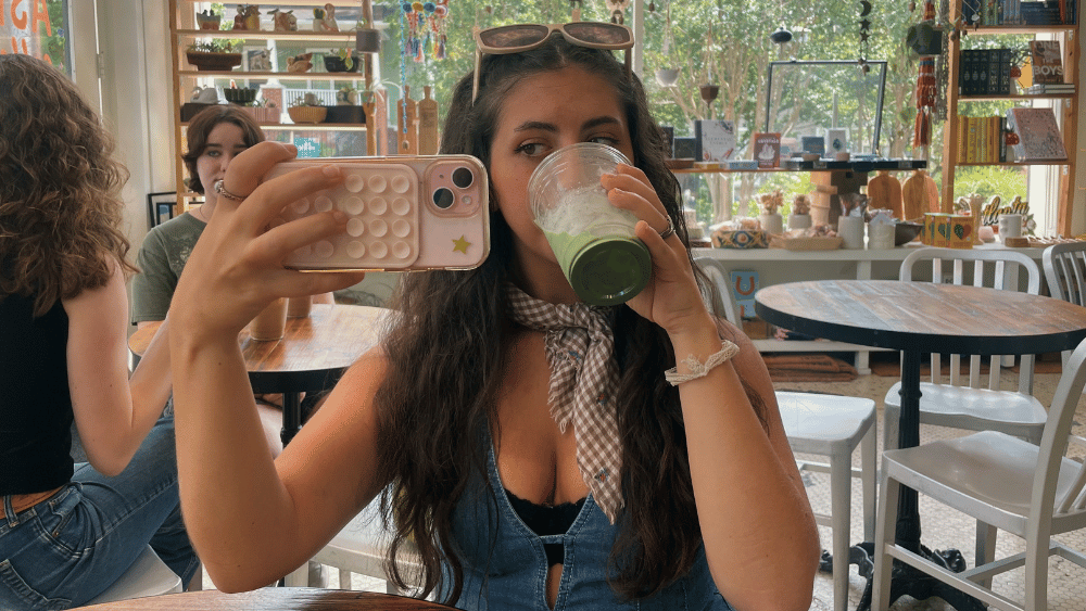 Gen Alpha girl drinking matcha and taking a picture for social media - Dig & Dig