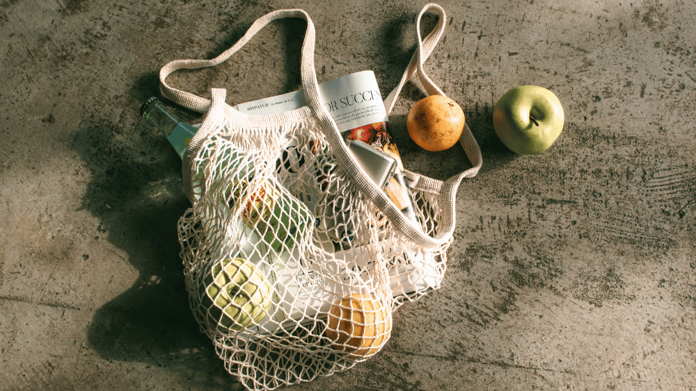 Net bag on the floor with consumer products spilling out - Dig & Dig